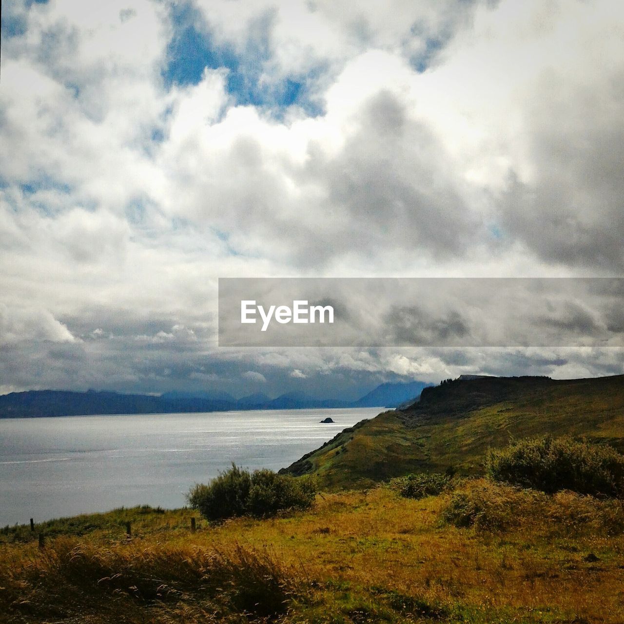 Scenic view of cloudy sky over mountains