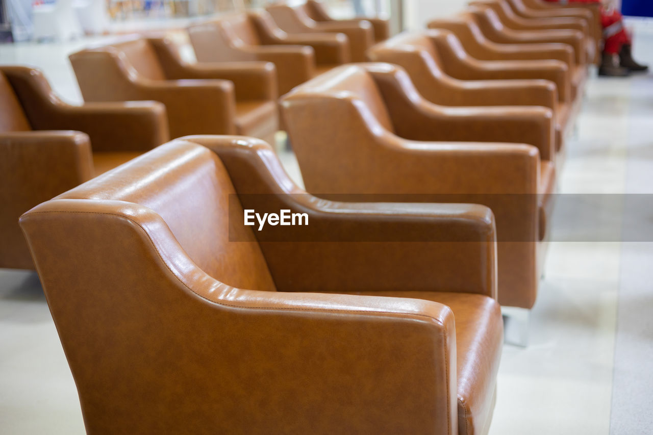 CLOSE-UP OF EMPTY CHAIRS IN TABLE