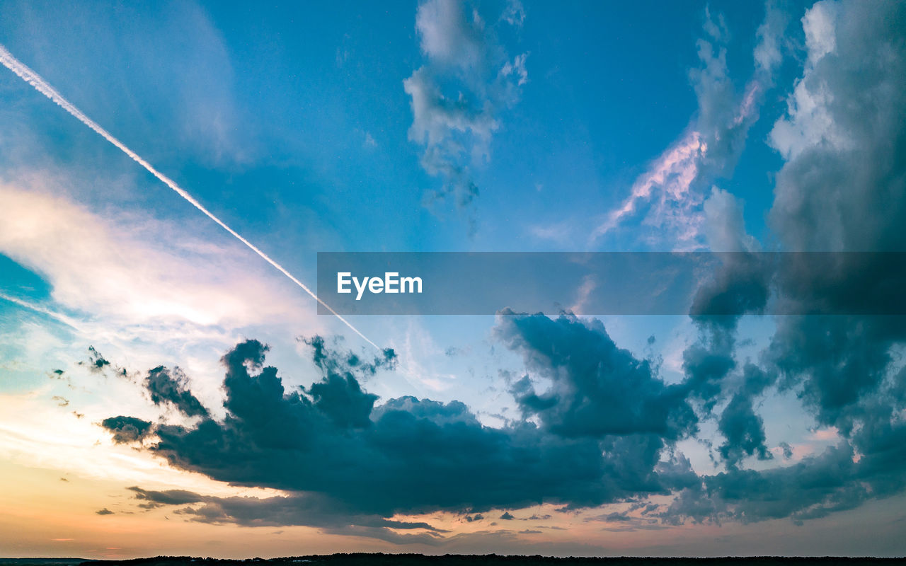 Low angle view of clouds in sky during sunset