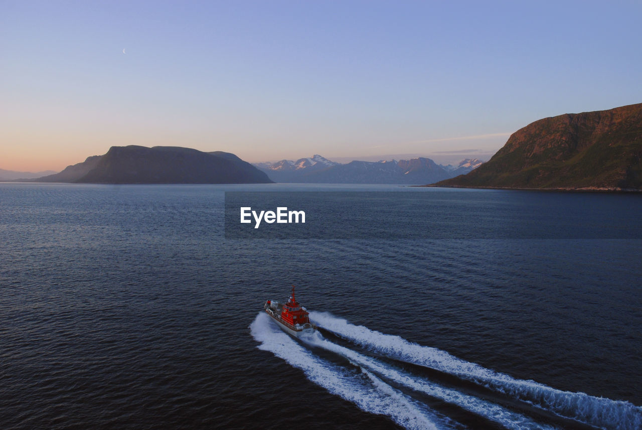 Boat in sea against clear sky