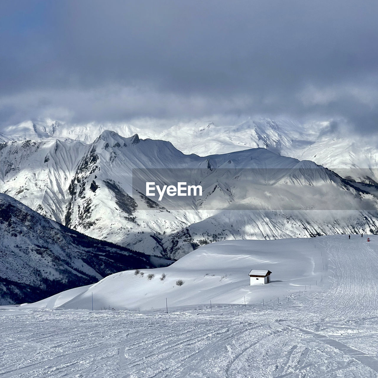 snow, winter, cold temperature, mountain, scenics - nature, environment, beauty in nature, mountain range, landscape, snowcapped mountain, piste, nature, sky, cloud, tranquil scene, tranquility, travel, travel destinations, winter sports, non-urban scene, no people, day, ski, white, ski equipment, land, ski touring, ski mountaineering, outdoors, vacation, tourism, idyllic, frozen, transportation, sports, holiday, trip, resort