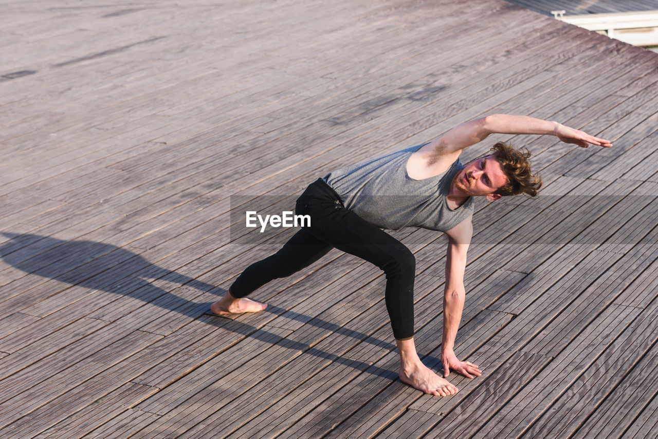 High angle view of man exercising outdoors