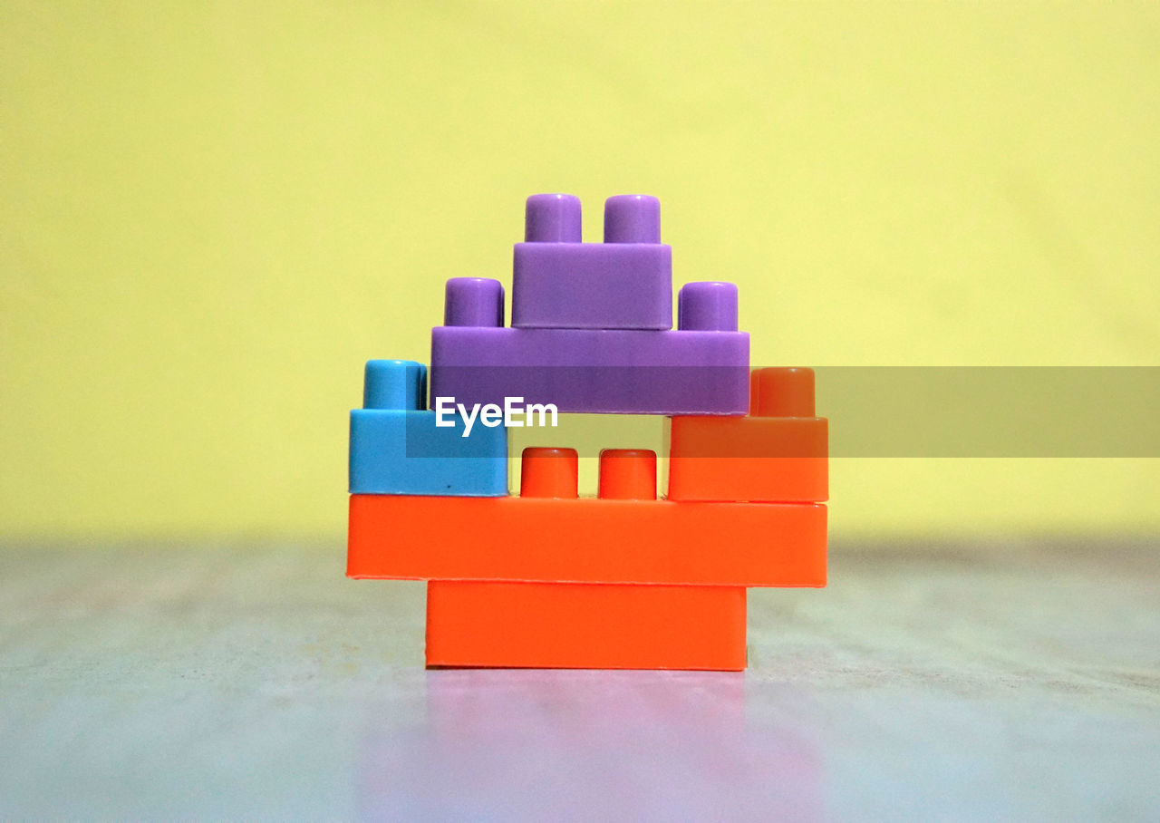 CLOSE-UP OF STUFFED TOY ON TABLE