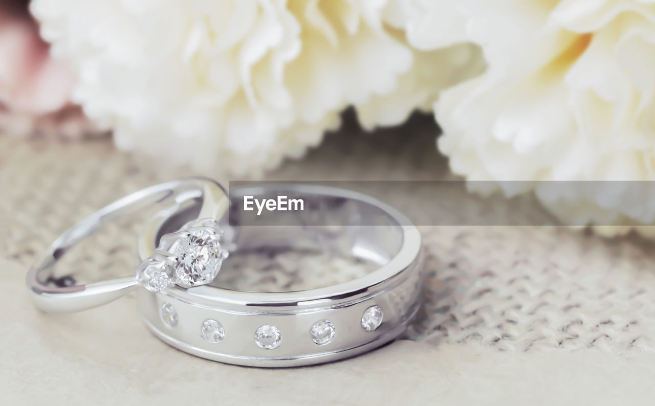 High angle view of wedding rings on table