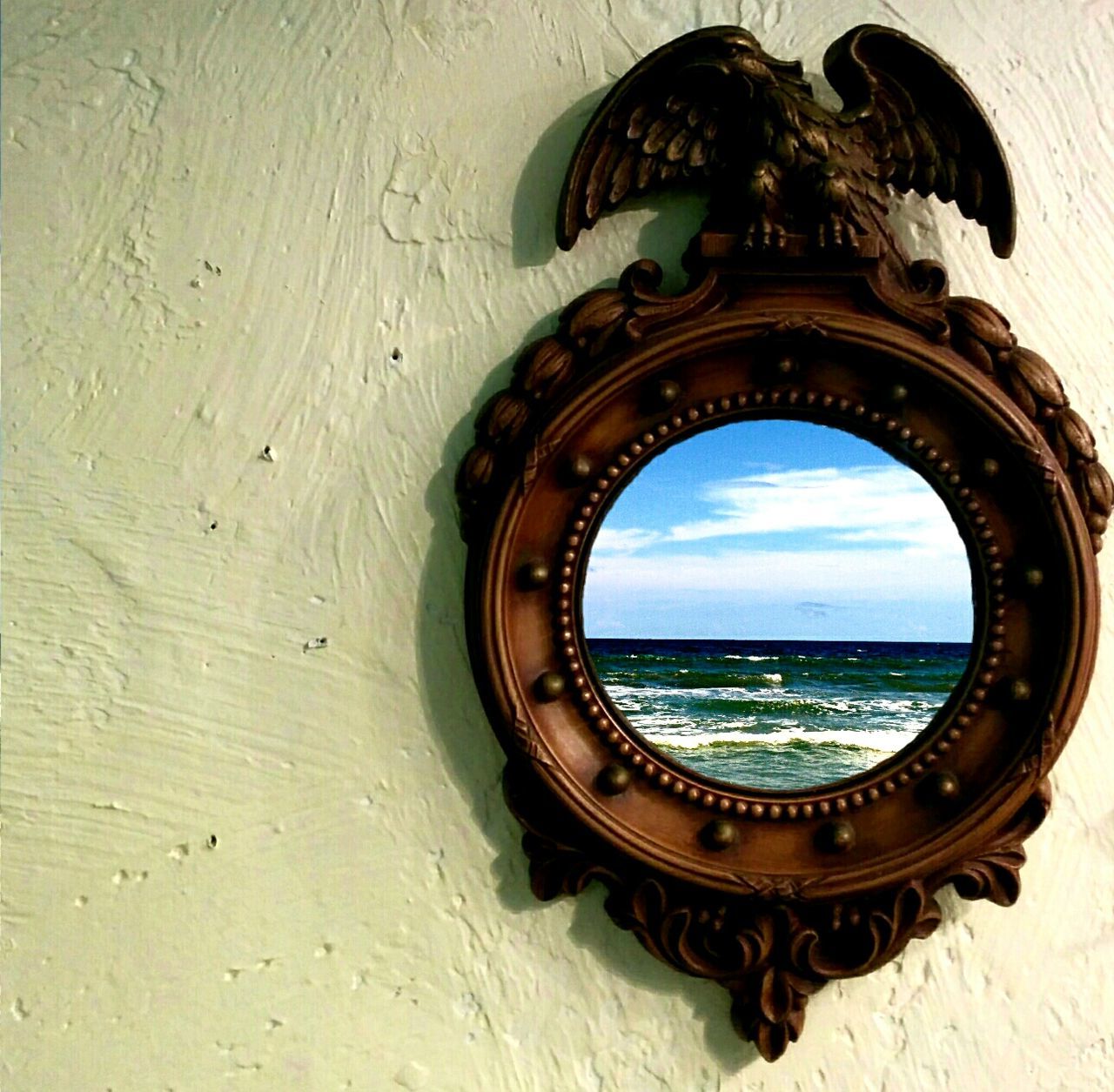 Close-up of picture frame hanging on wall