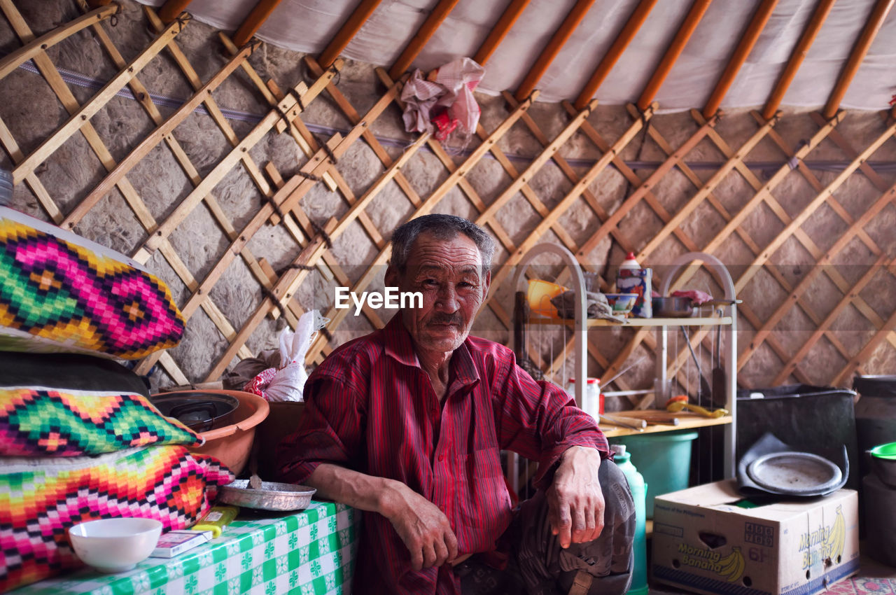 MAN WORKING AT MARKET STALL