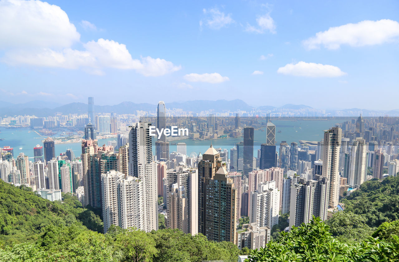 Panoramic view of buildings in city against sky