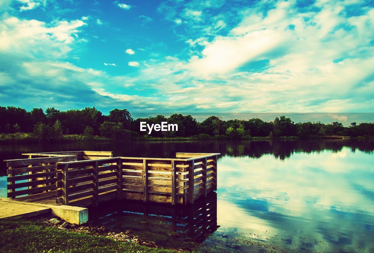 BUILT STRUCTURE IN LAKE AGAINST SKY