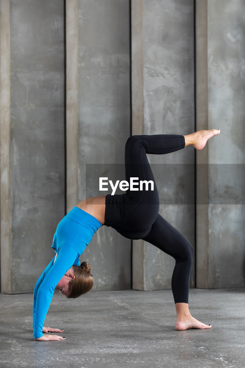 low section of woman exercising on floor