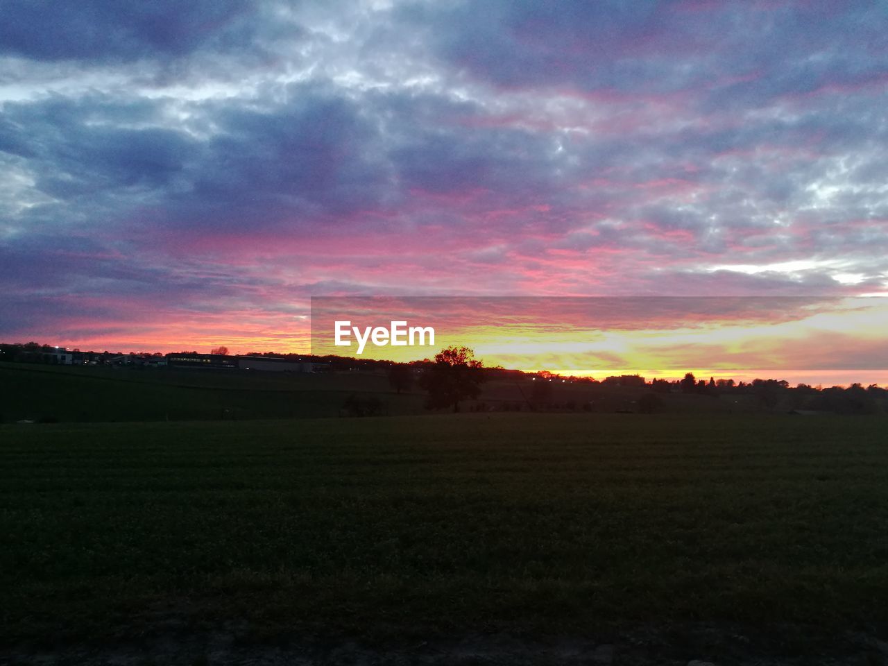 SCENIC VIEW OF SUNSET OVER LAND