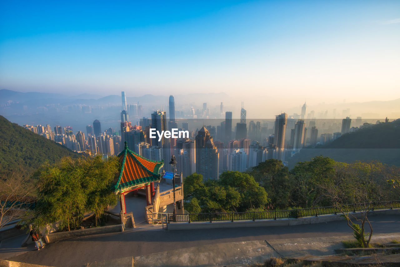 Victoria peak at sunrise time. skyscraper view from famous place of hong kong city