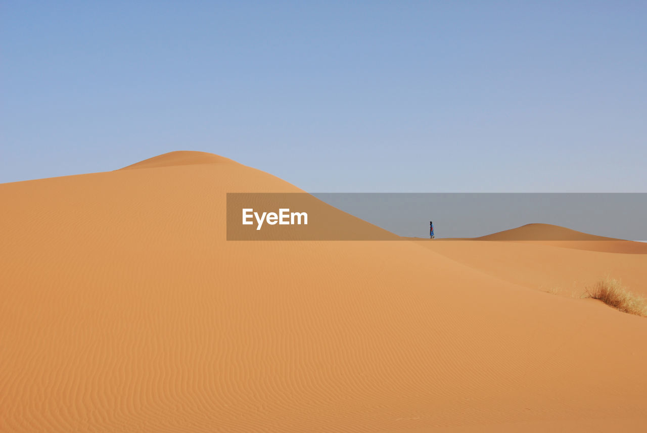 Scenic view of desert against clear sky