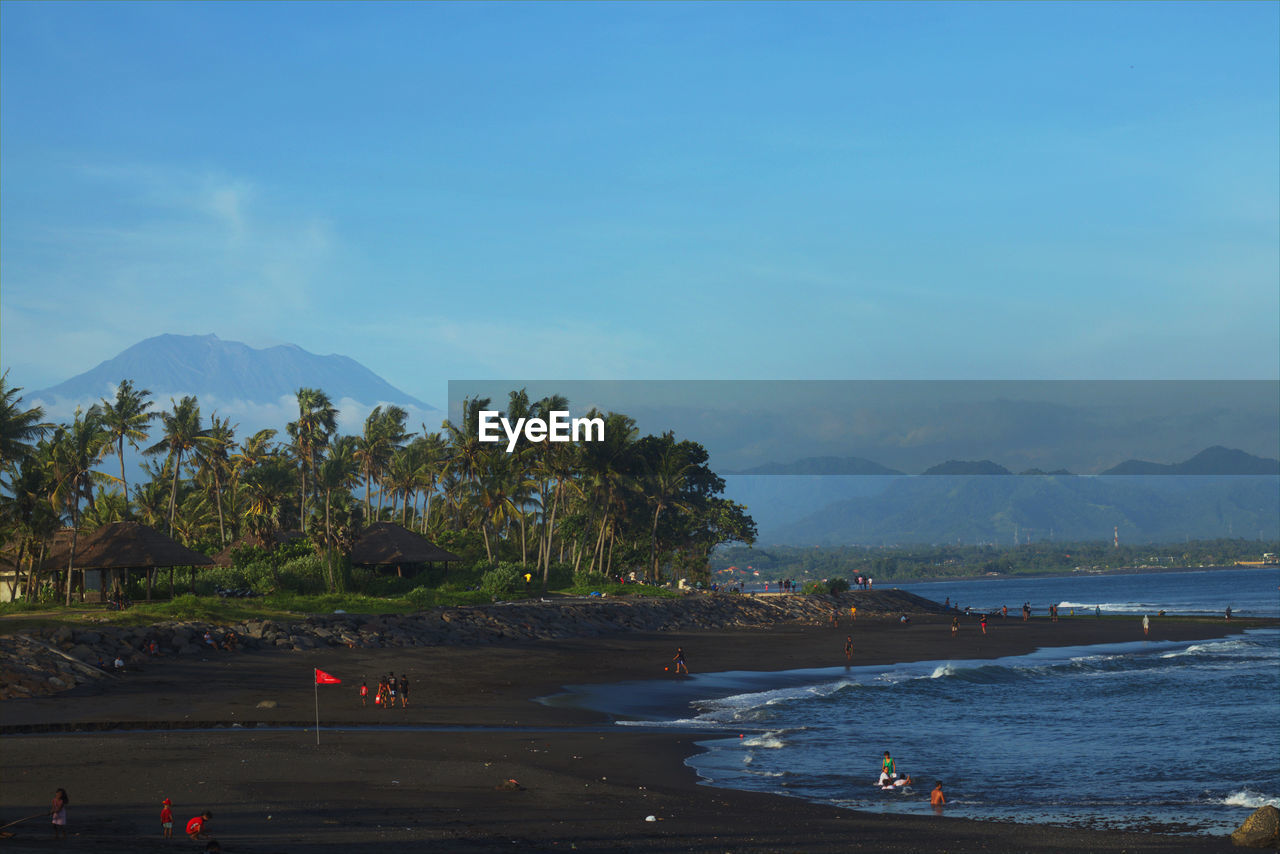 Scenic view of mount agung and bali beach against sky