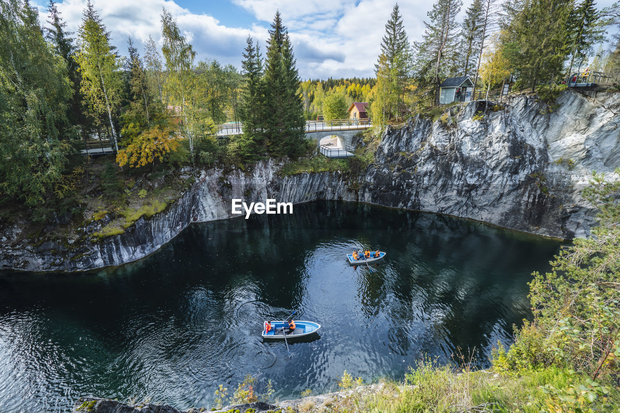 Pleasure boat in marble canyon in the mountain park of ruskeala, karelia, russia