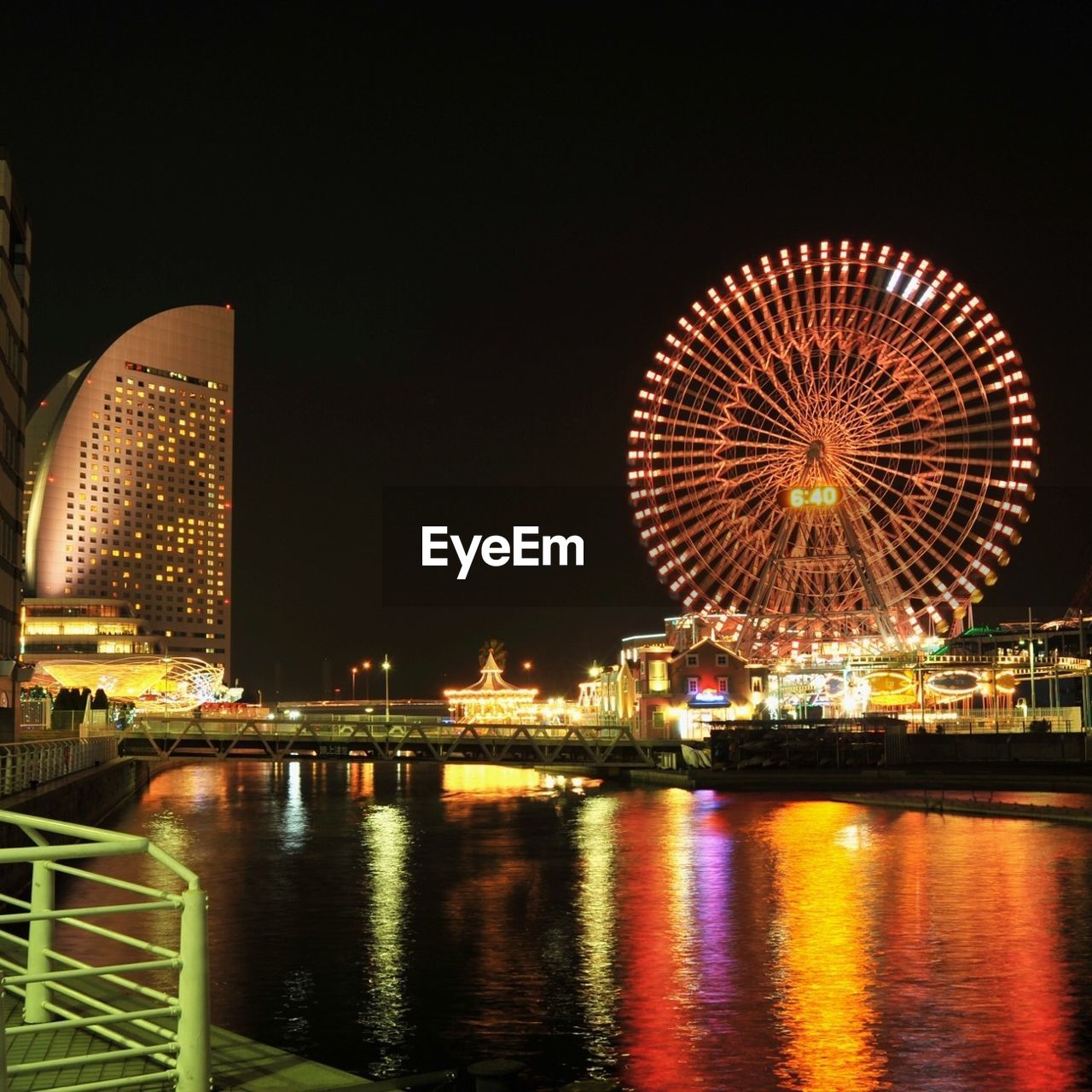 REFLECTION OF ILLUMINATED BUILDINGS IN WATER