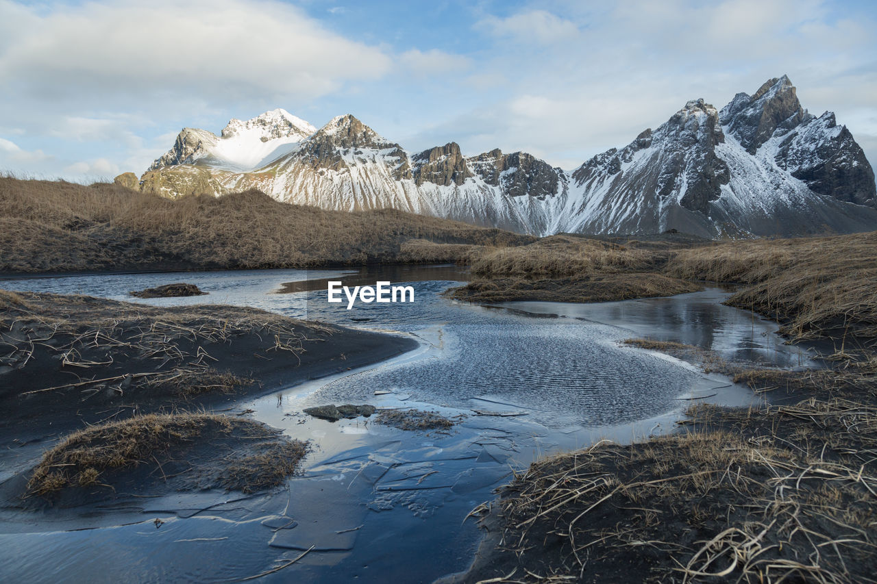 Scenic view of mountains against sky during winter