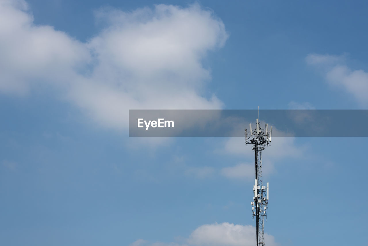 Low angle view of communications tower against sky