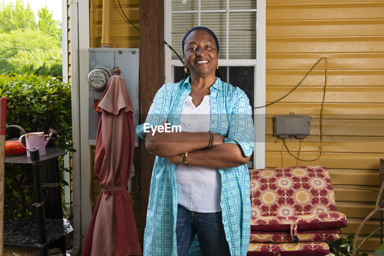 Portrait of a smiling african-american woman standing arms crossed