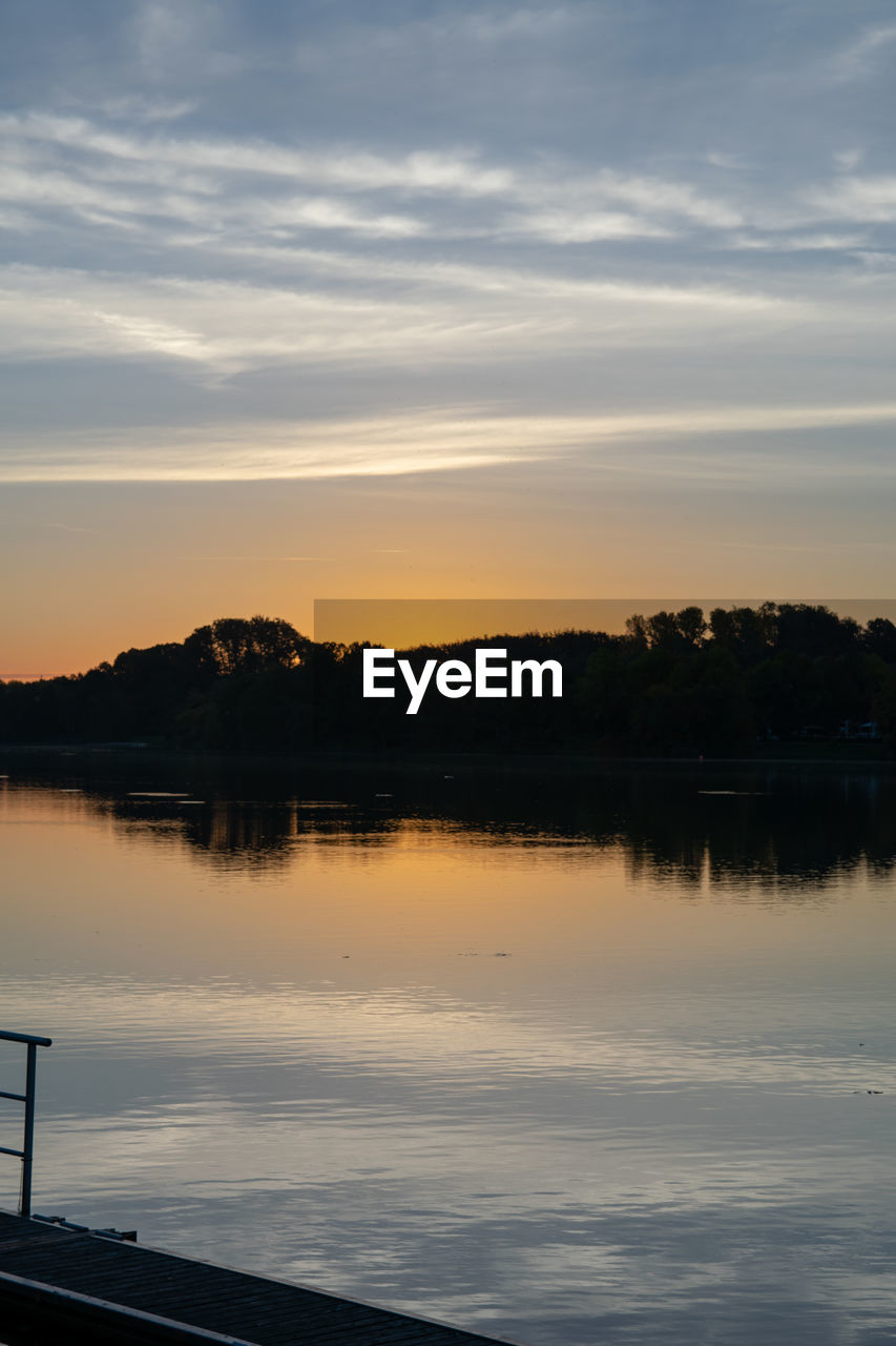 SCENIC VIEW OF LAKE DURING SUNSET