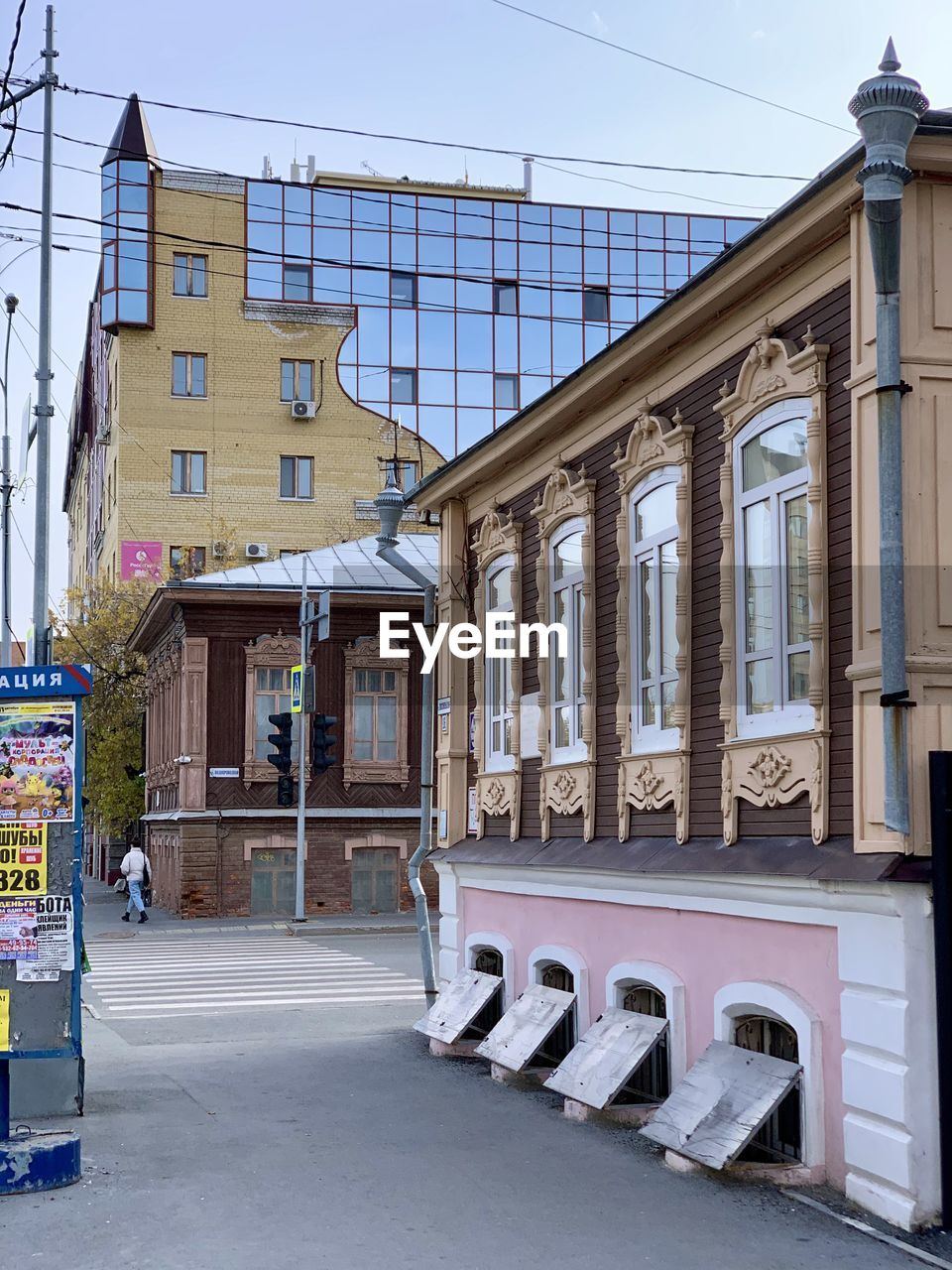 STREET BY BUILDING AGAINST SKY