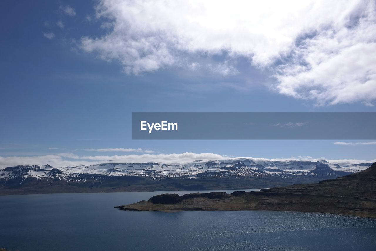 View of calm lake against rocky landscape