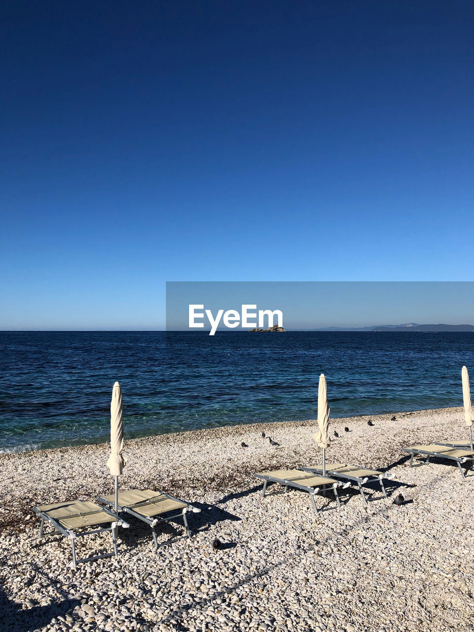 SCENIC VIEW OF BEACH AGAINST CLEAR SKY