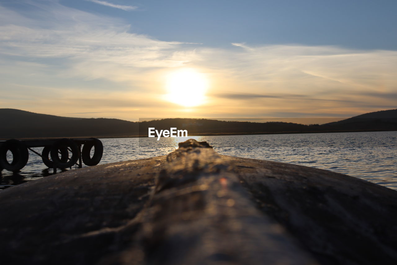 SCENIC VIEW OF SUNSET OVER SEA