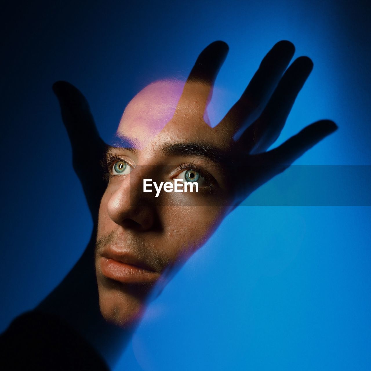 Close-up of boy seen through glass