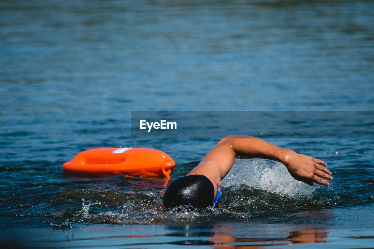 Man swimming in pool