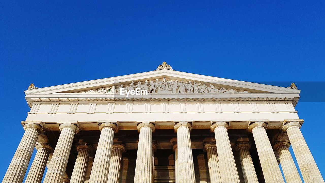 LOW ANGLE VIEW OF BUILT STRUCTURE AGAINST CLEAR BLUE SKY