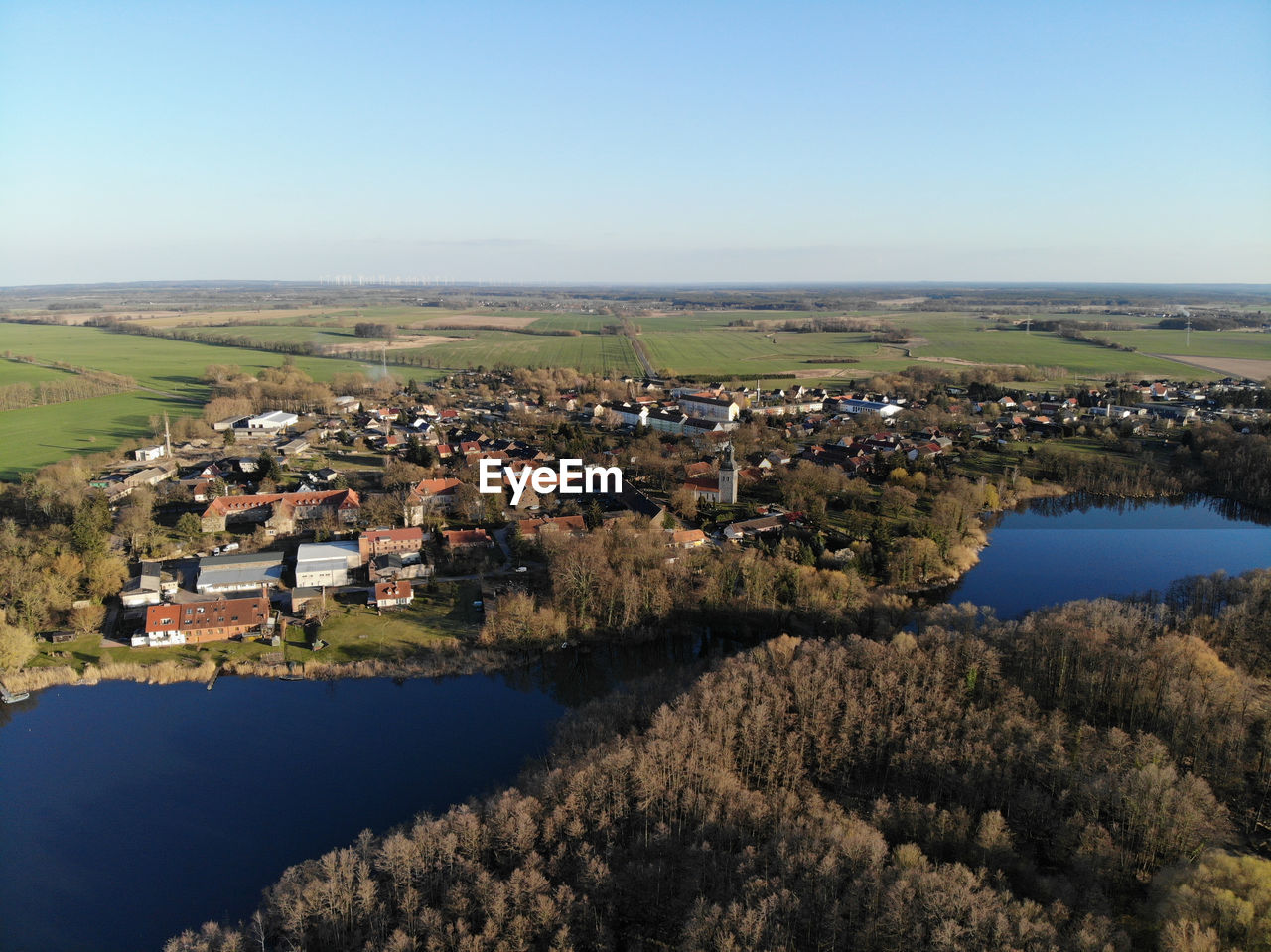 HIGH ANGLE VIEW OF TREES AND BUILDINGS AGAINST SKY