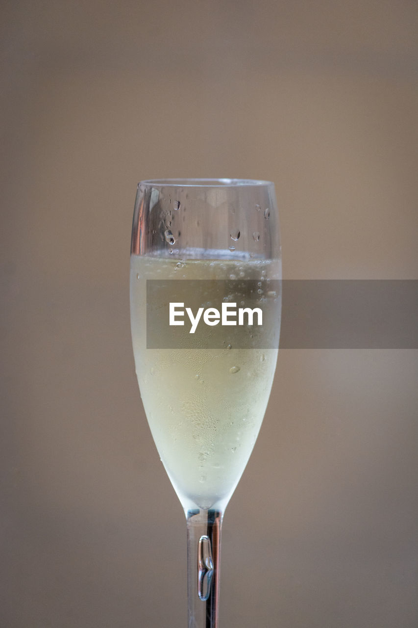 Close-up of wine glass against white background