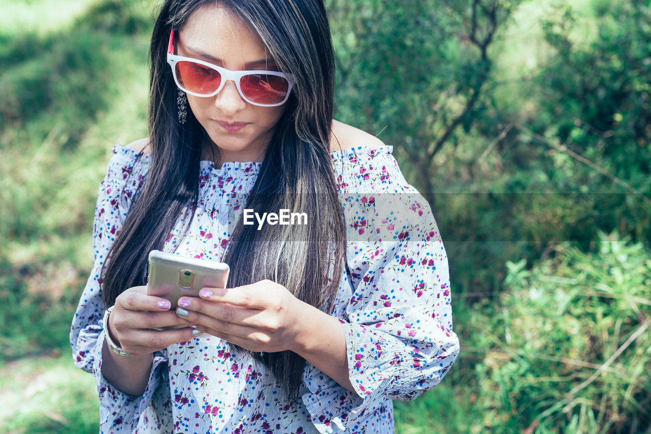 Young woman using mobile phone