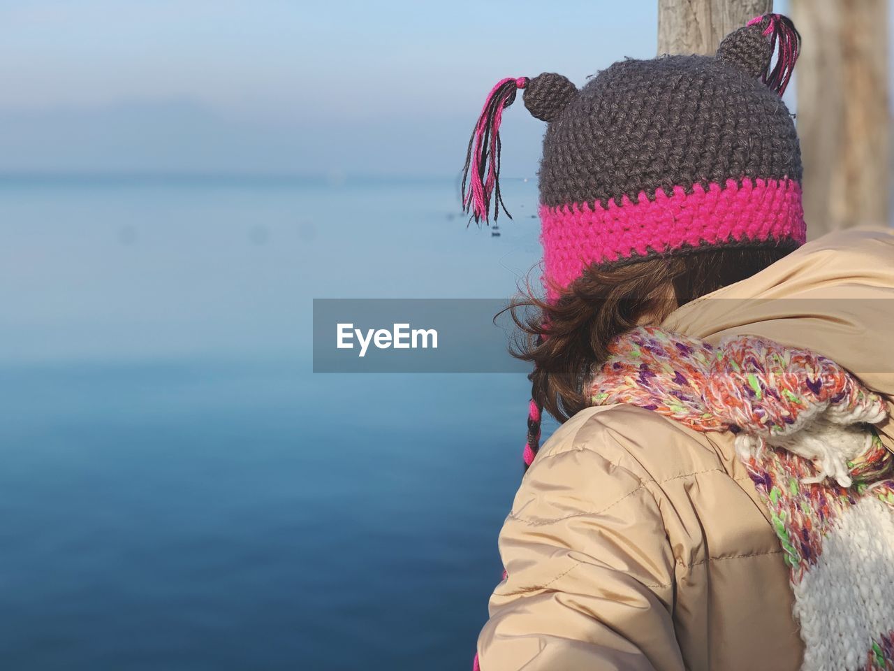 Rear view of woman looking at sea against sky