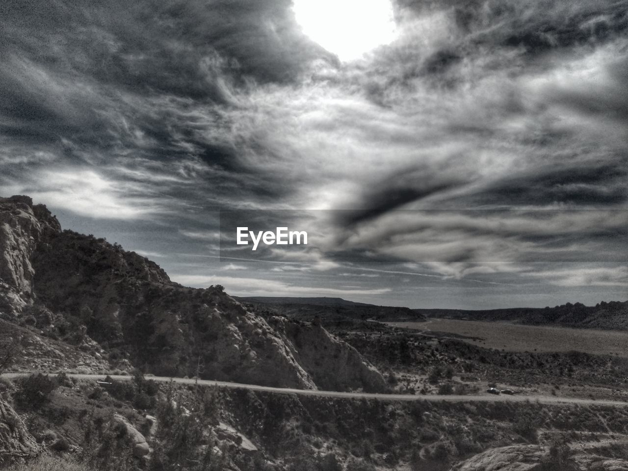 SCENIC VIEW OF LANDSCAPE AND MOUNTAINS AGAINST SKY