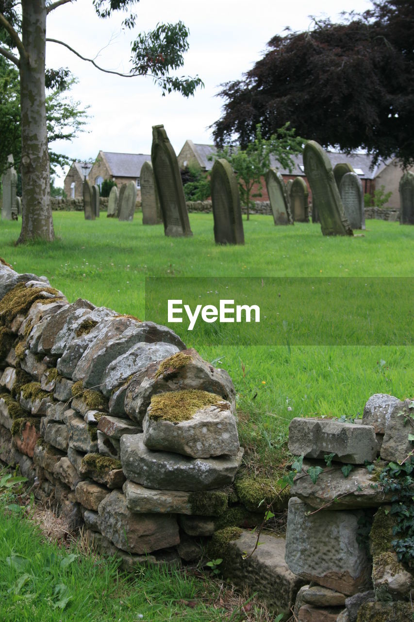 TOMBSTONES IN CEMETERY