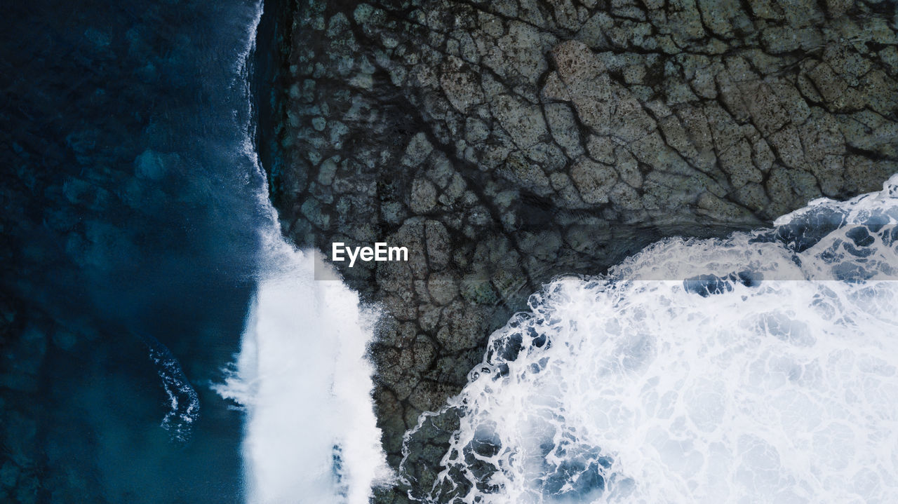 WATER FLOWING THROUGH ROCKS