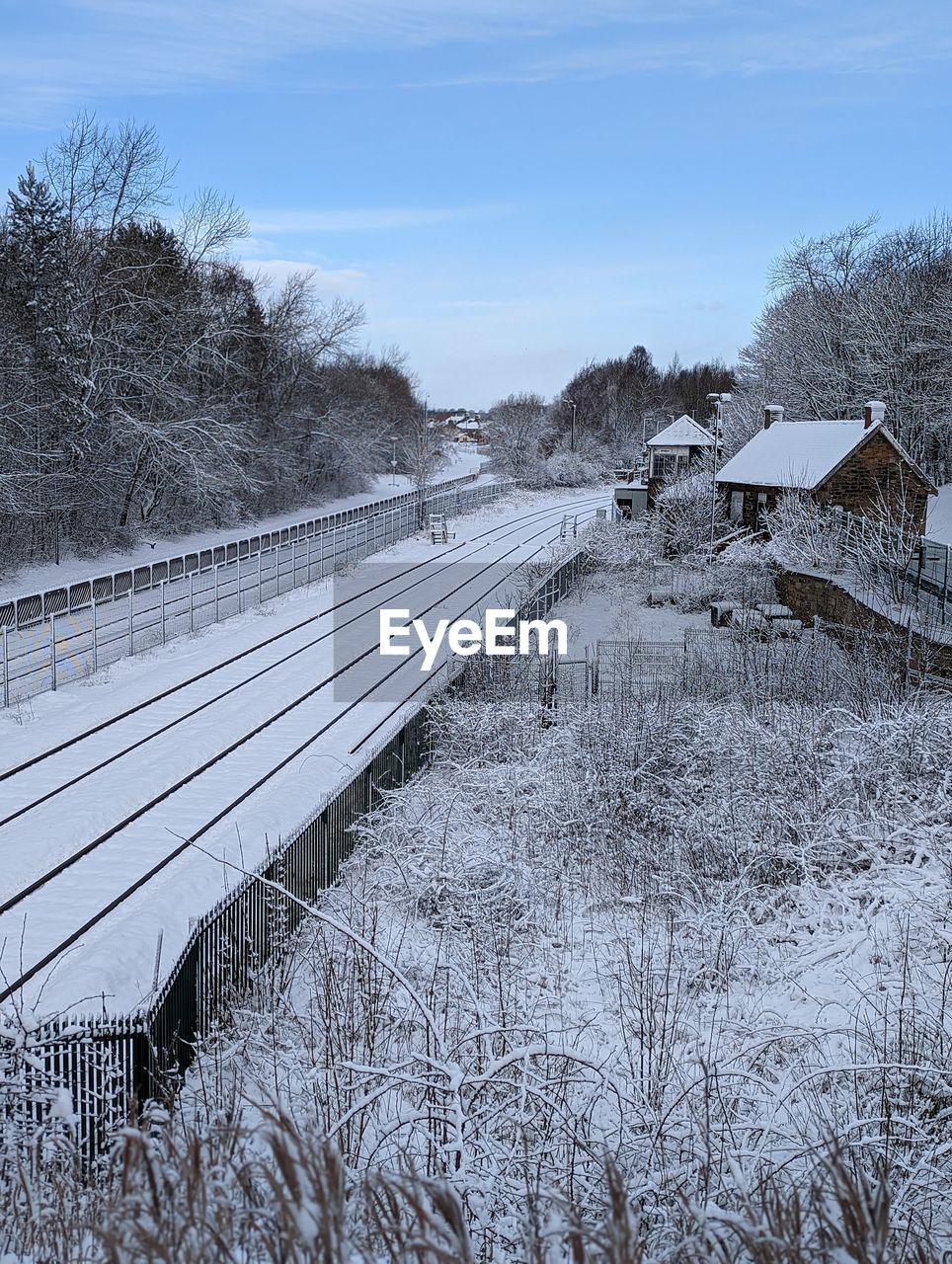 winter, snow, cold temperature, plant, tree, nature, sky, frost, no people, transportation, freezing, transport, track, environment, bare tree, day, architecture, landscape, rail transportation, built structure, scenics - nature, land, frozen, beauty in nature, outdoors, non-urban scene, cloud, railroad track, tranquility, travel, tranquil scene, ice