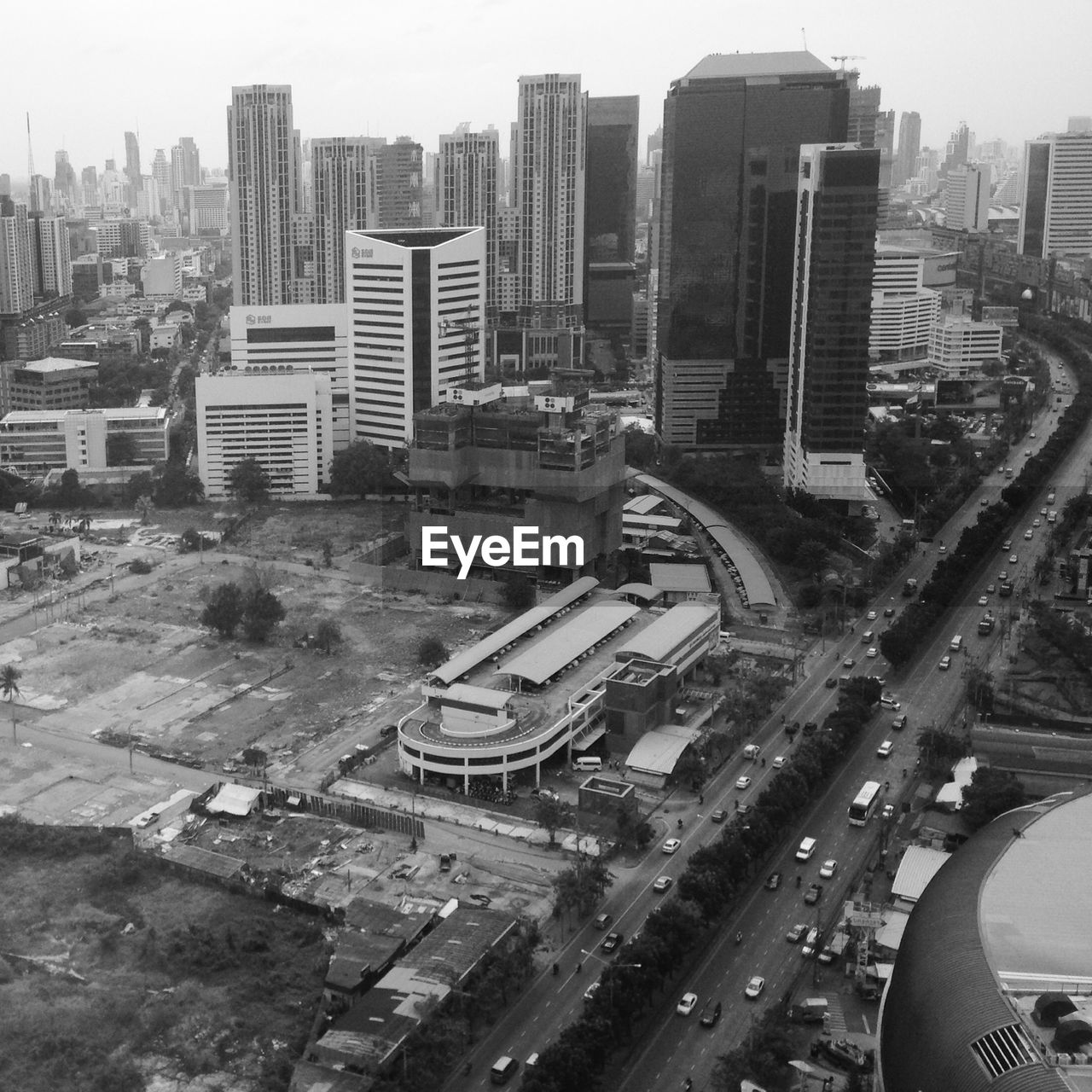 High angle view of street leading towards buildings in city