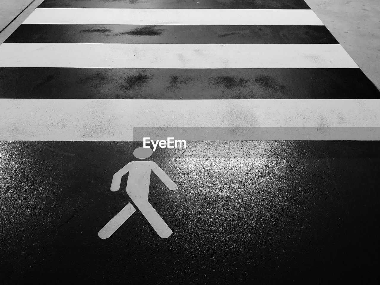 High angle view of pedestrian crossing sign on road