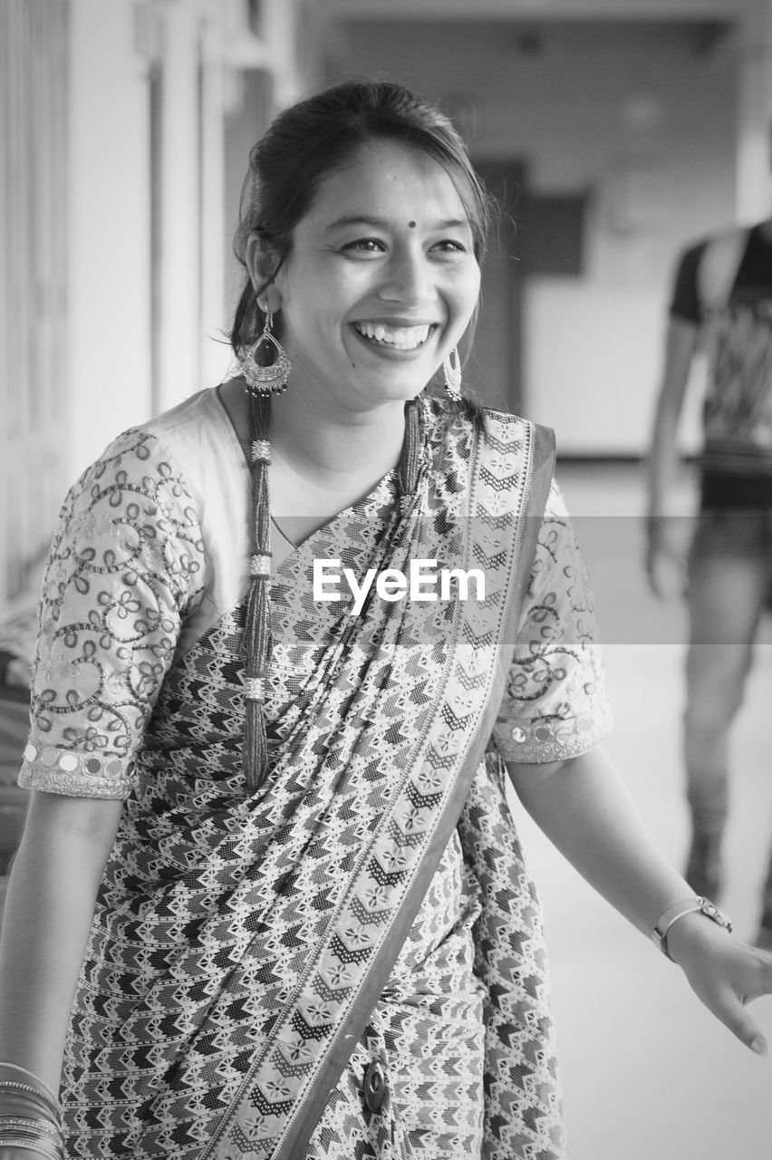 Smiling young woman looking away