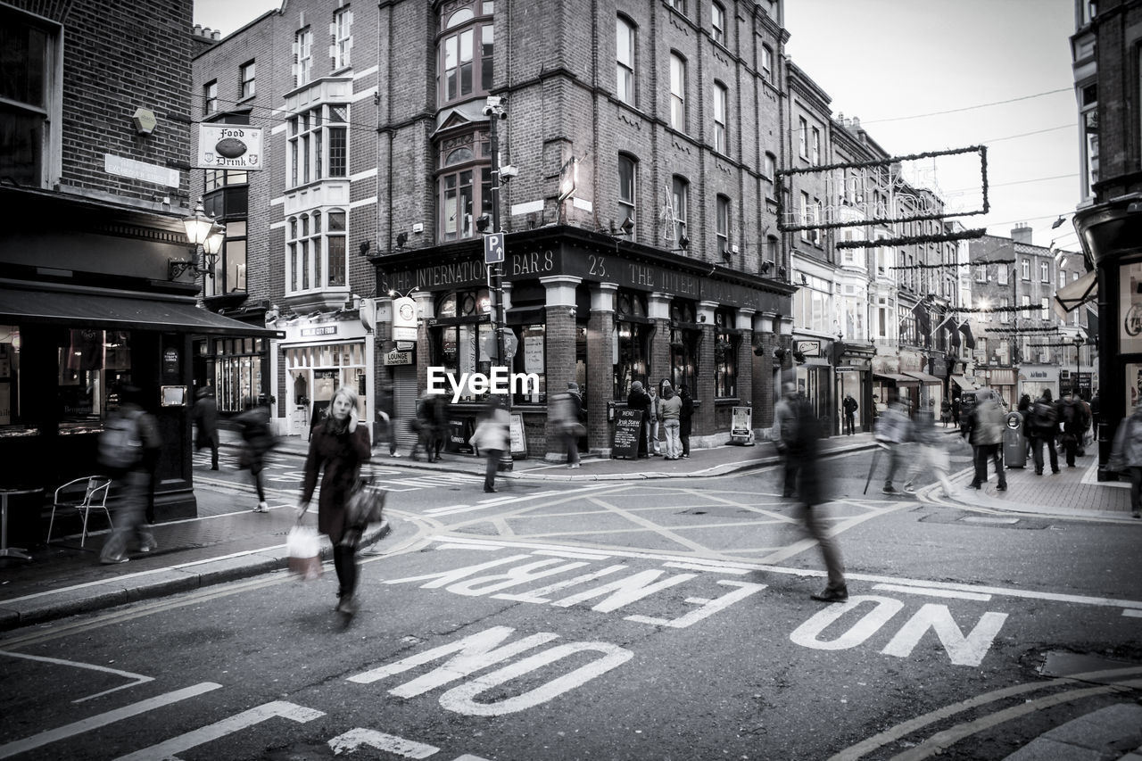 WOMEN WALKING ON CITY STREET