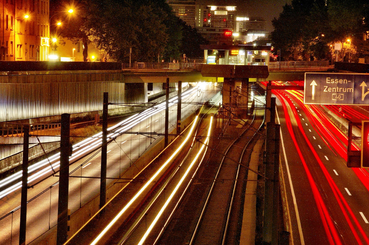 LIGHT TRAILS IN CITY AT NIGHT