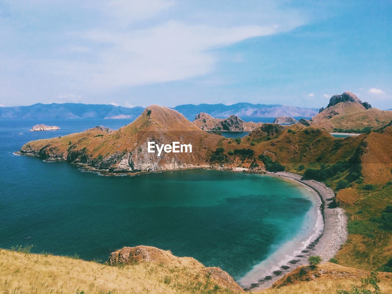 Panoramic view of sea and mountains against sky