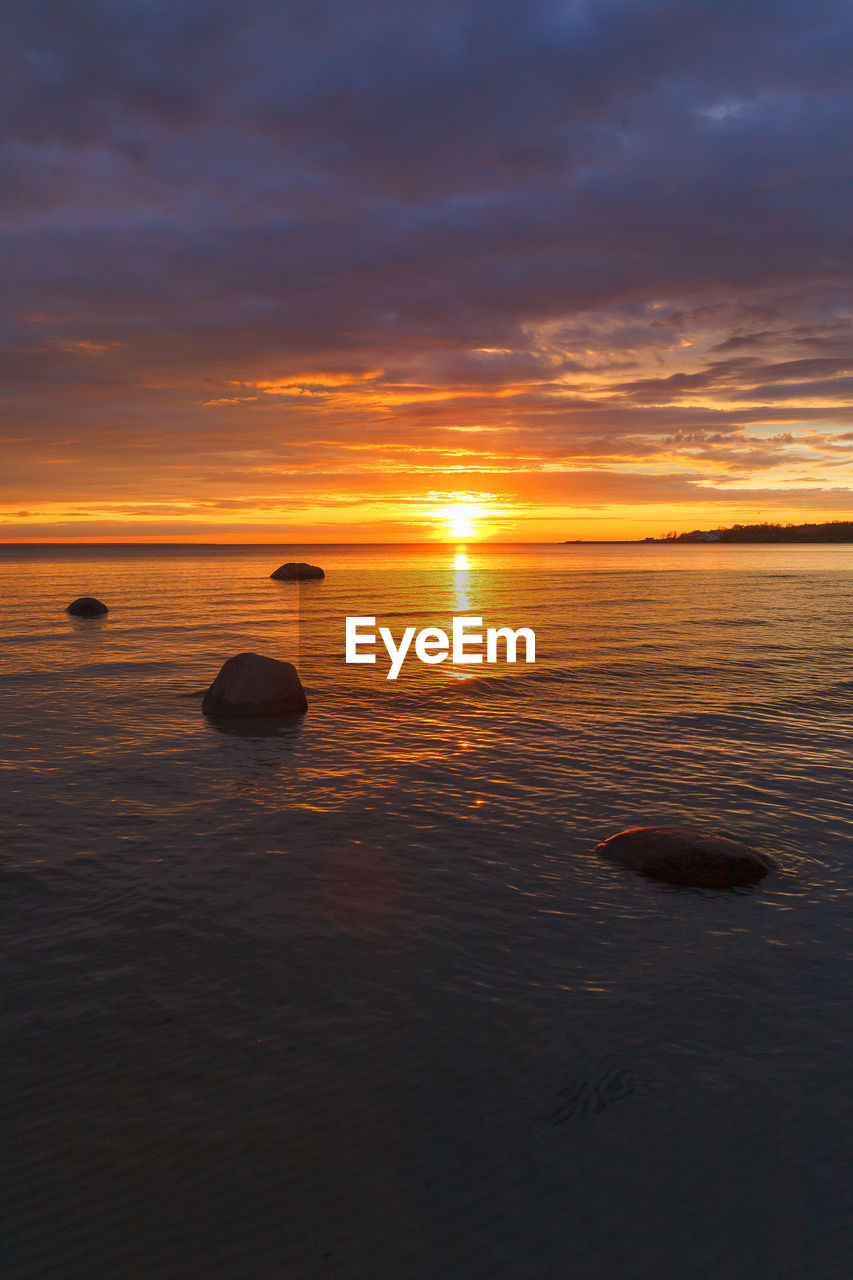 sky, water, sunset, sea, beauty in nature, scenics - nature, tranquility, cloud, nature, tranquil scene, horizon over water, ocean, horizon, orange color, reflection, land, idyllic, no people, beach, coast, dramatic sky, shore, seascape, outdoors, afterglow, sun, sunlight, dawn, non-urban scene