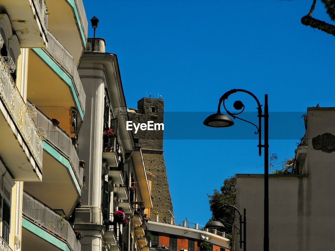 Low angle view of buildings against blue sky