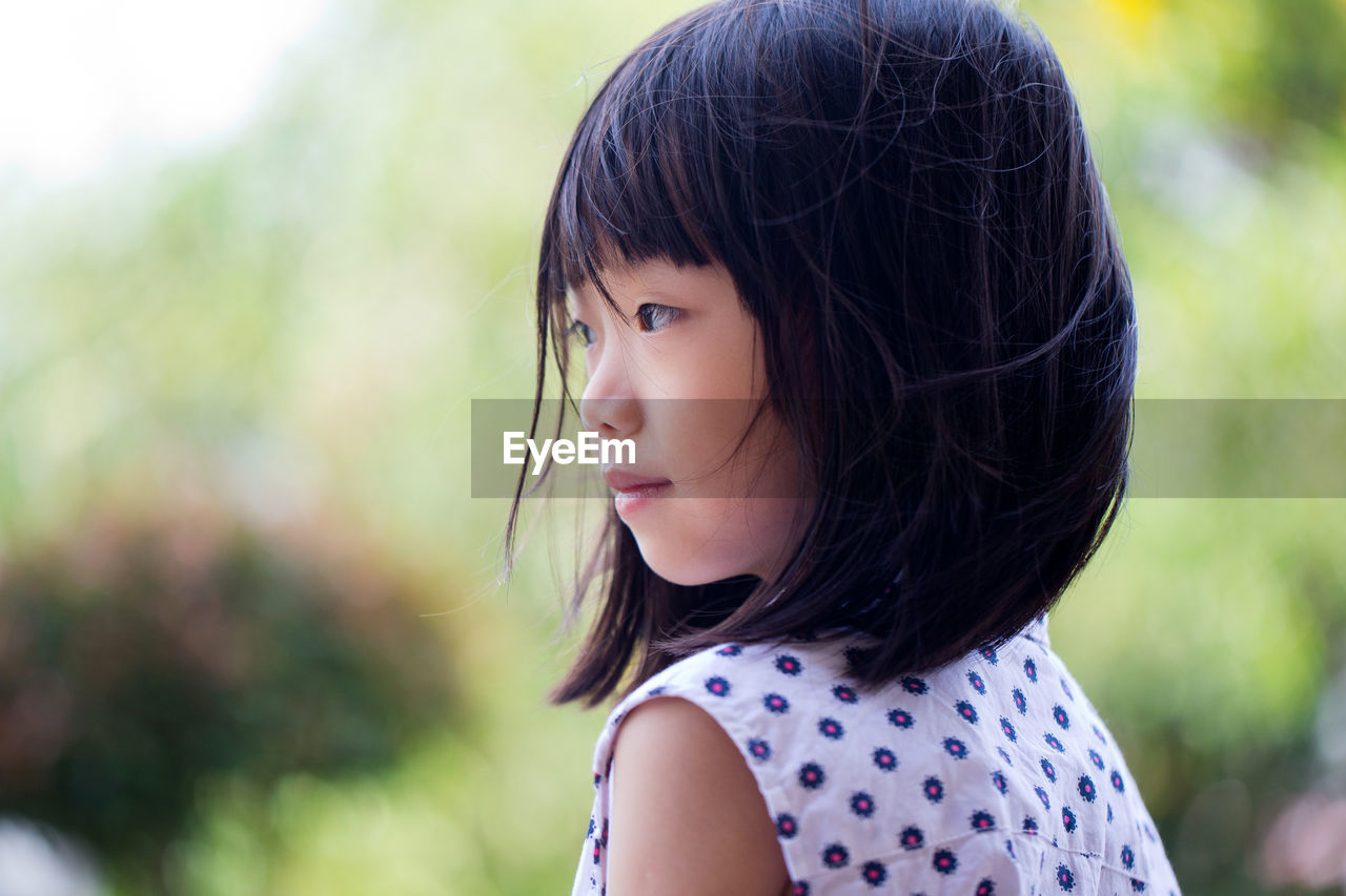 Close-up of girl looking away