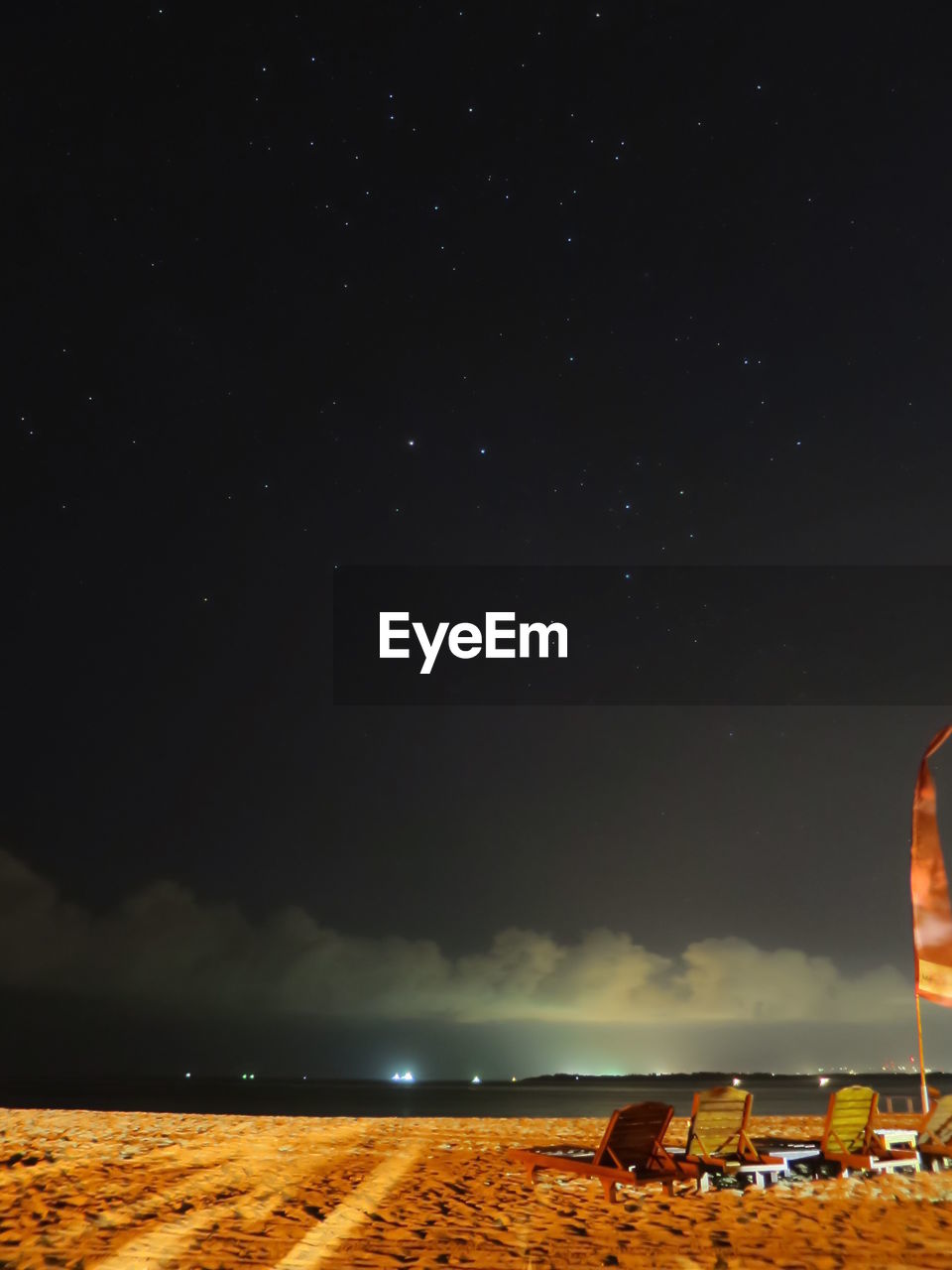 Scenic view of sandy beach during night