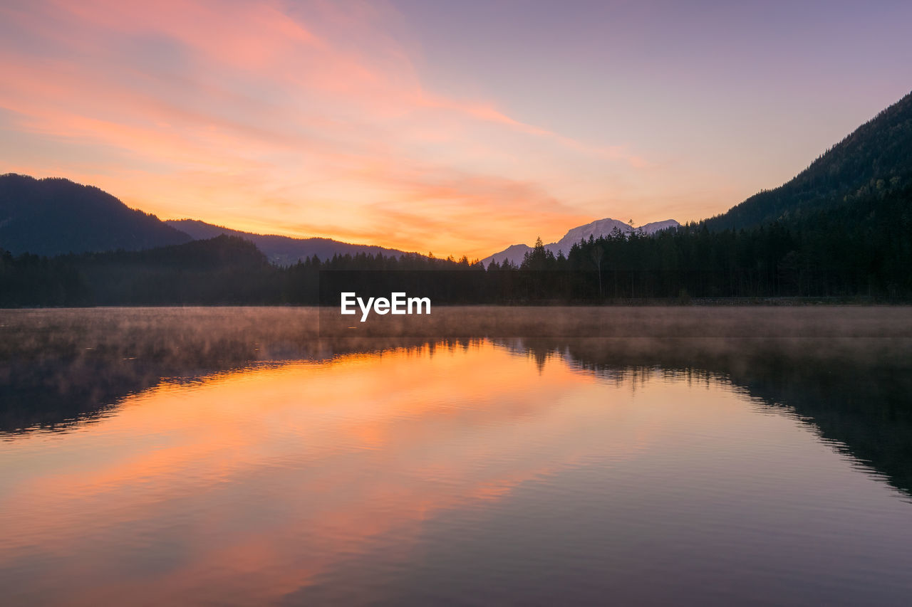 Scenic view of lake against sky during sunset