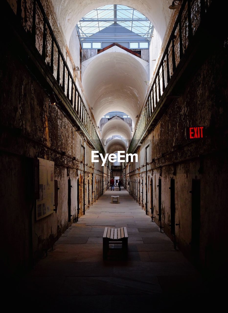 Empty bench in corridor at prison